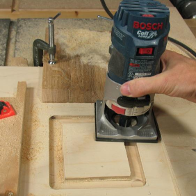 Picture of a Woodworker Using a Router